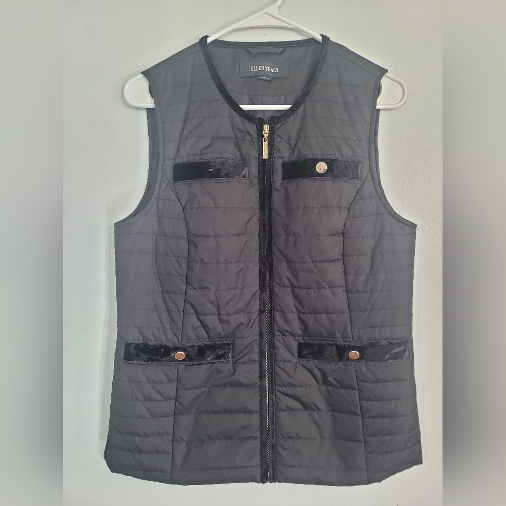 Black quilted vest with velvety details.